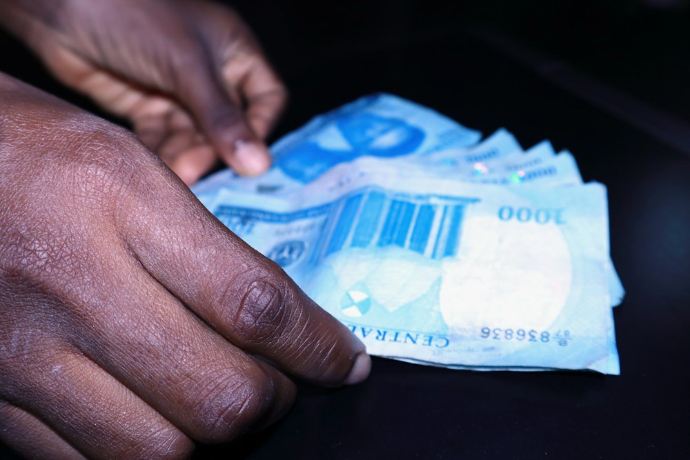Hands counting Naira notes